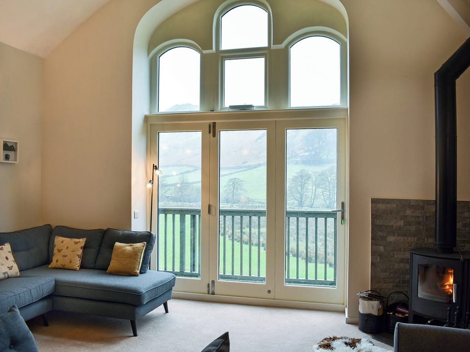 Homely living area with balcony | Howegrain Lodge, Martindale, near Ullswater