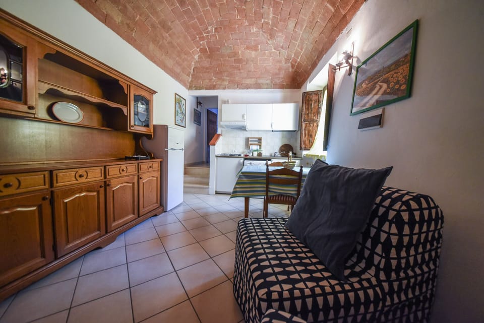 Apartment, 1 Bedroom (In Famiglia) | Living area | Flat-screen TV