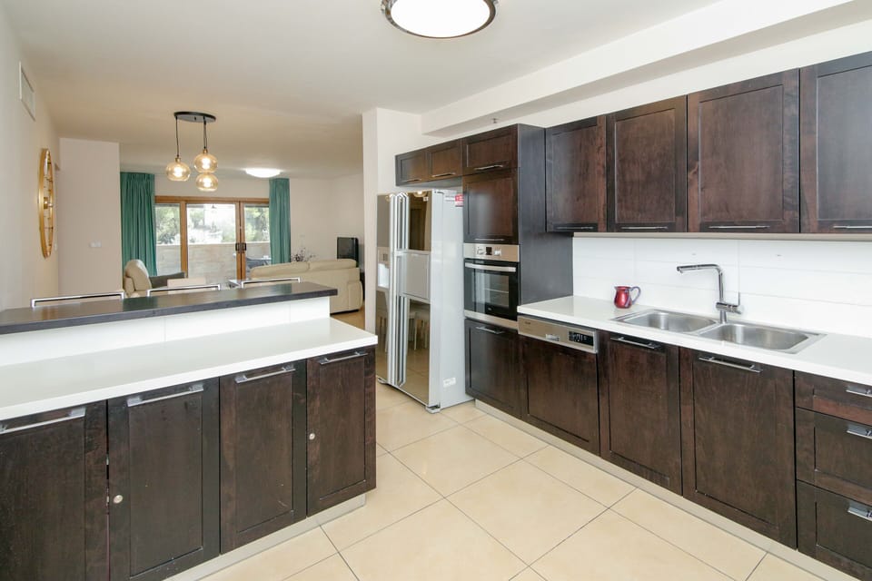 Luxury Apartment | Private kitchen | Full-size fridge, microwave, oven, stovetop