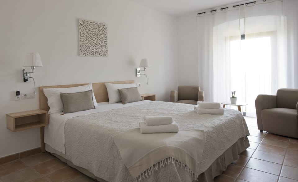 Suite | Down comforters, memory foam beds, individually furnished