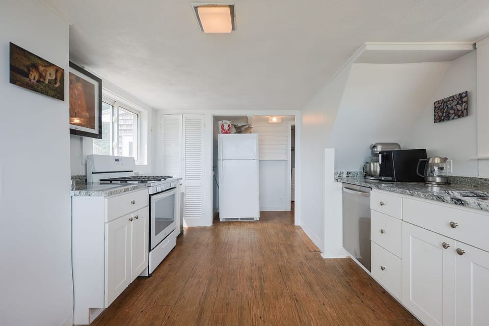The kitchen has ample space for prep and storage.