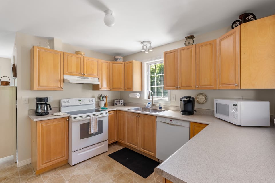 A fully equipped kitchen featuring modern appliances.