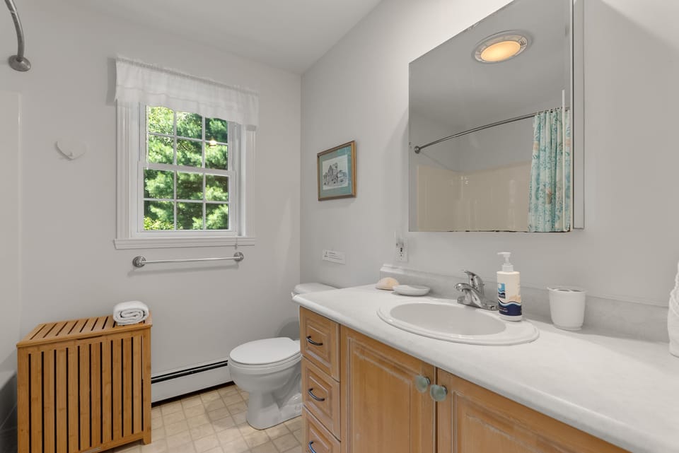 Full Bath across from the Den with walk in shower.