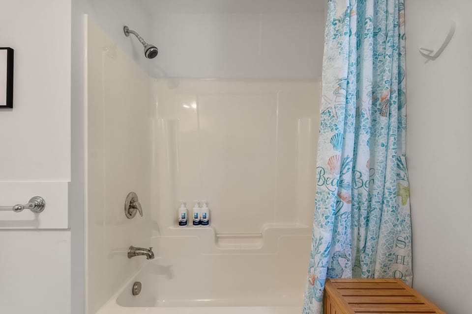 Full Bath across from the Den with walk in shower.