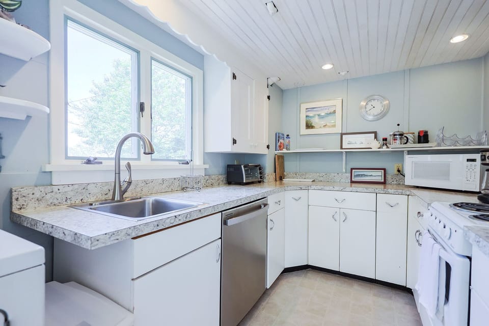 The kitchen is spacious with plenty of room to cook and store essentials.