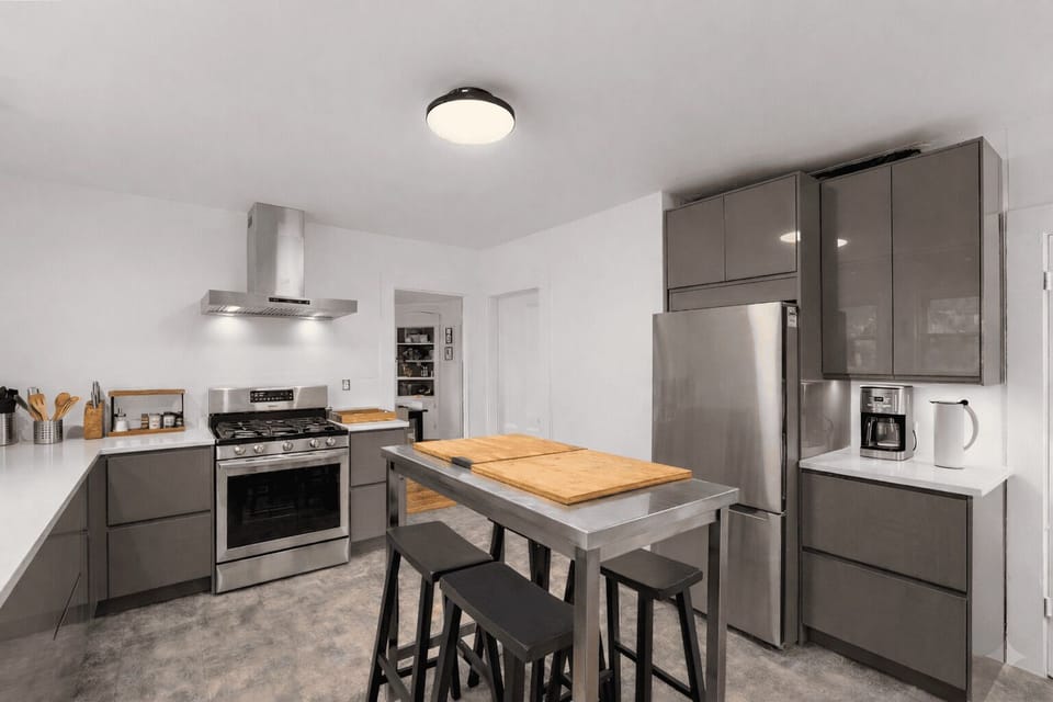 The center island can be used for meal prep or dining.