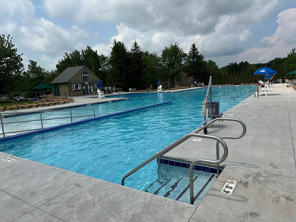 50 meter pool with lifeguard on duty at all times while open.