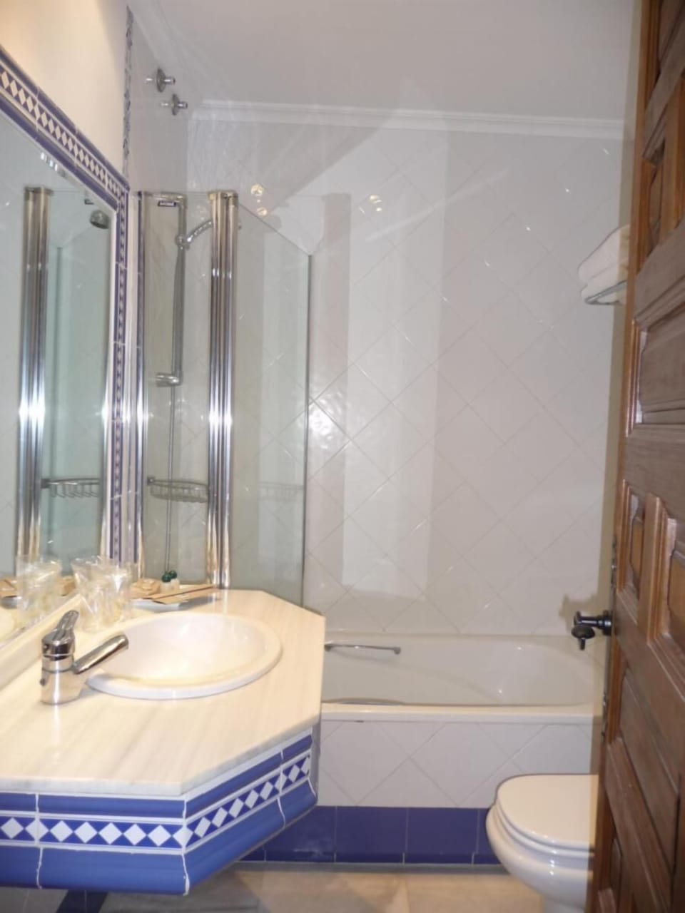 Bathtub, hair dryer, bathrobes, towels