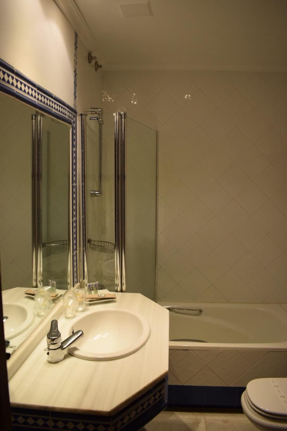 Bathtub, hair dryer, bathrobes, towels