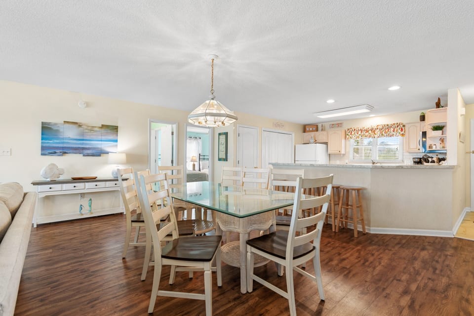 Your bright dining area flows seamlessly into the fully equipped kitchen, perfect for gathering around meals and morning coffee together.