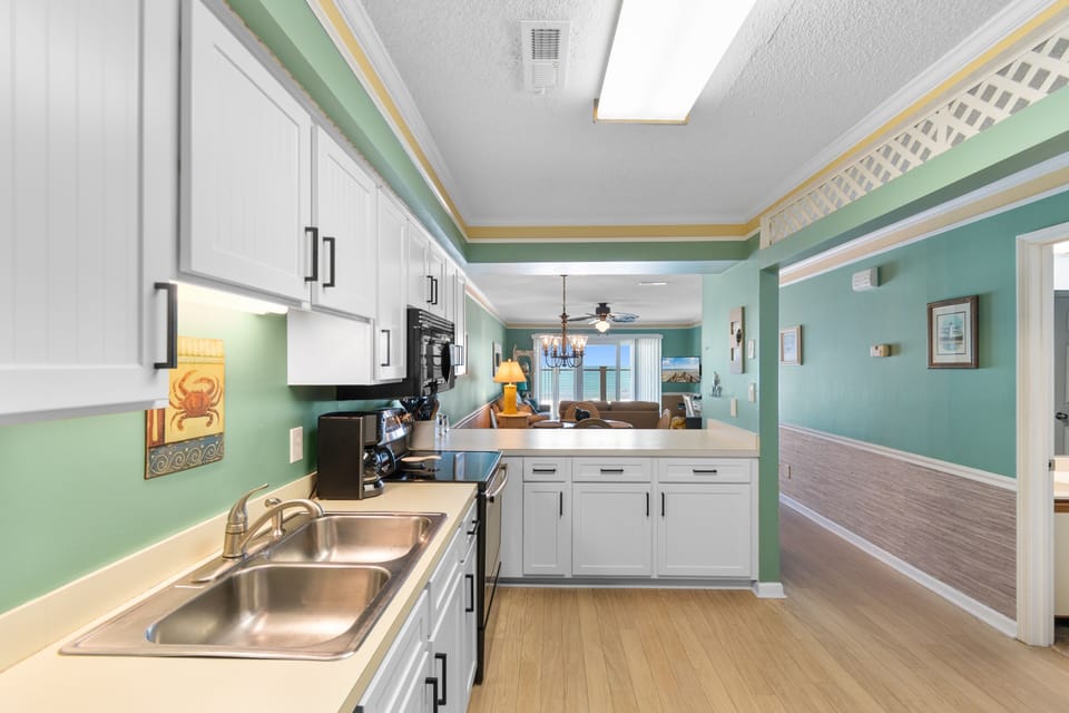 Your fully equipped kitchen flows seamlessly into the dining and living areas, making meal prep effortless while keeping you connected to family and friends throughout your stay.