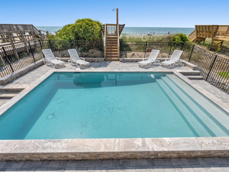 Soak up the sun in your private pool while gazing at the sparkling ocean just steps away.