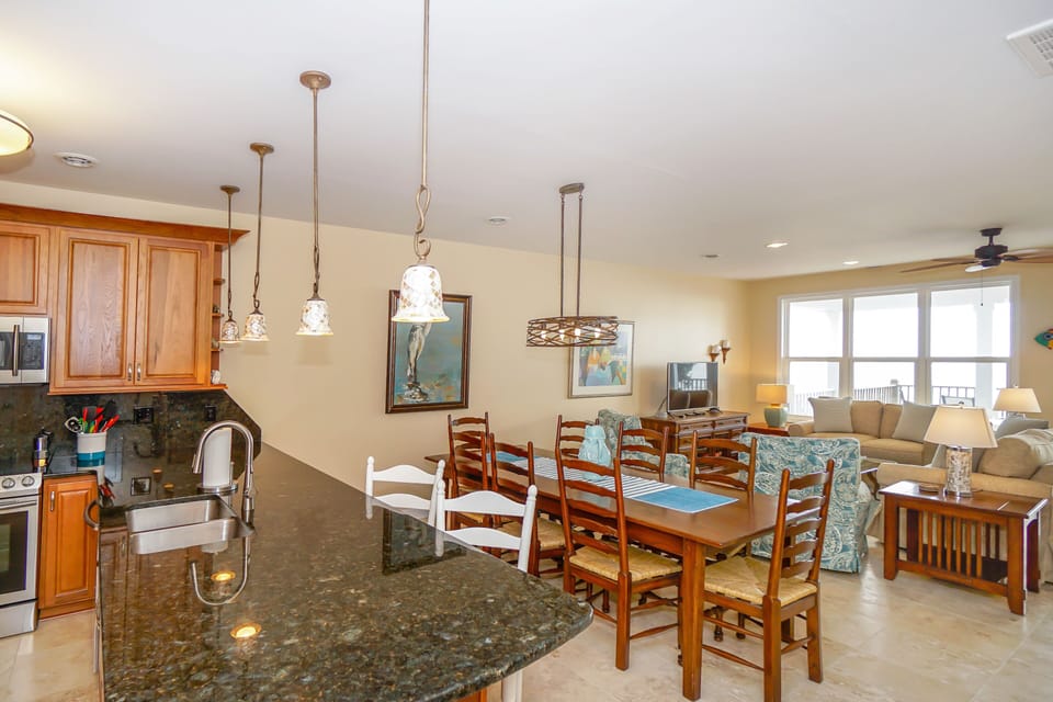 Gather around your spacious dining table while meals simmer in the fully-equipped kitchen, then relax in the comfortable living room.