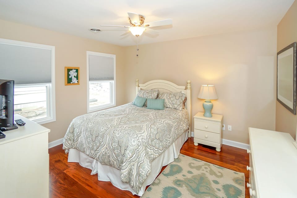 Drift off to sleep in your peaceful bedroom, where soft lighting and gentle colors create a tranquil retreat.