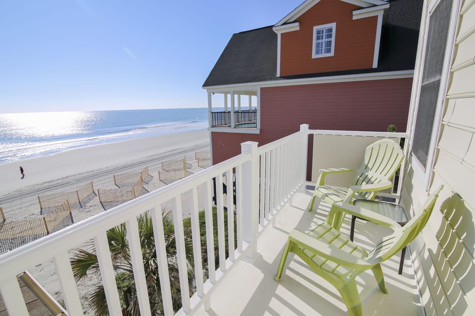 Your private balcony overlooks endless ocean views where you'll sip morning coffee watching waves kiss the shore.