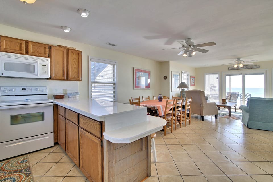 Your spacious open-concept kitchen flows seamlessly into the dining and living areas, perfect for gathering with loved ones.