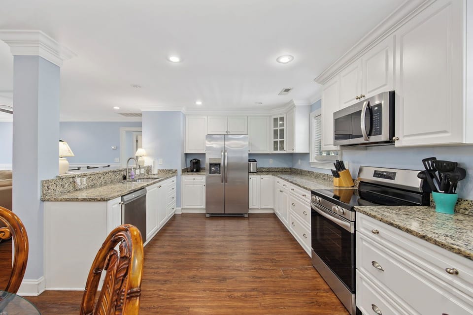 Your fully equipped kitchen features granite countertops, stainless steel appliances, and everything you need to create memorable meals during your stay.