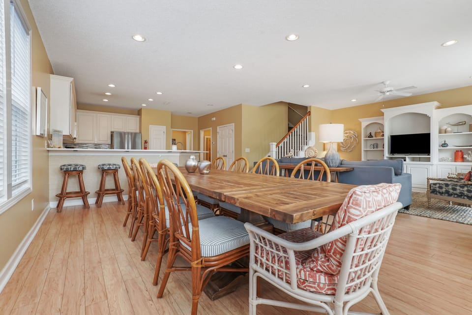 Gather around the rustic dining table where your group can share memorable meals together in this open-concept space.
