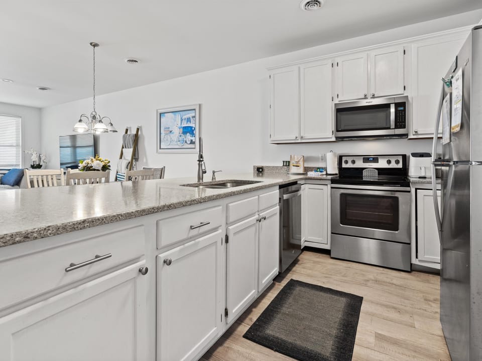 Your fully equipped kitchen features granite countertops, stainless steel appliances, and everything you need to create memorable meals during your stay.
