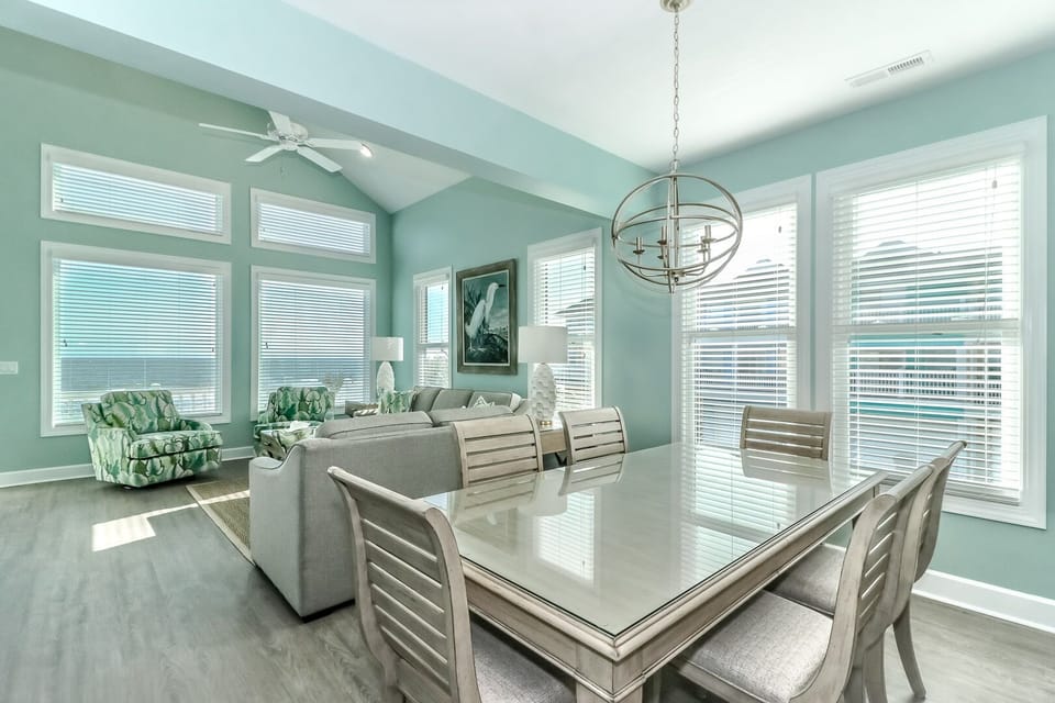 Relax in your bright, airy dining space where soft walls and abundant natural light create the perfect setting for memorable meals together.