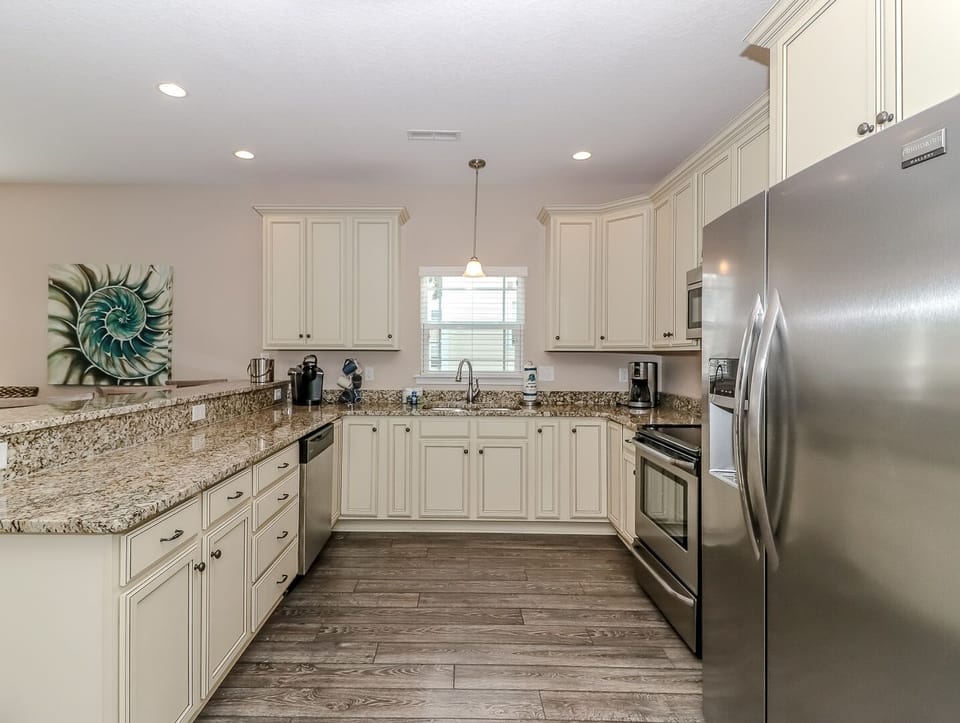 Your gourmet kitchen awaits with granite countertops, stainless appliances, and everything needed to create memorable vacation meals together.