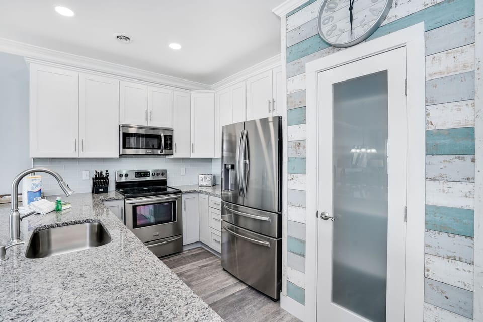 Your fully equipped kitchen features stainless steel appliances and granite counters, perfect for preparing meals during your stay.