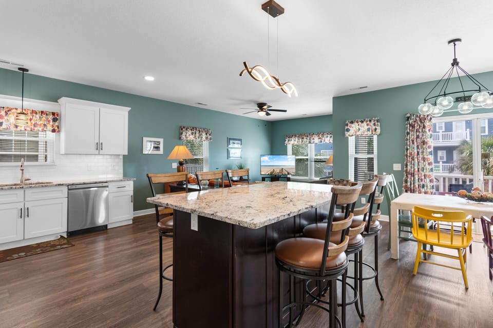 Gather around your spacious kitchen island for memorable meals and conversations in this bright, inviting space.