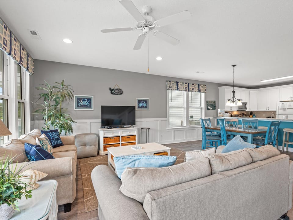 Relax in this bright open living space where coastal charm meets comfort - your perfect retreat for unwinding after beach days.