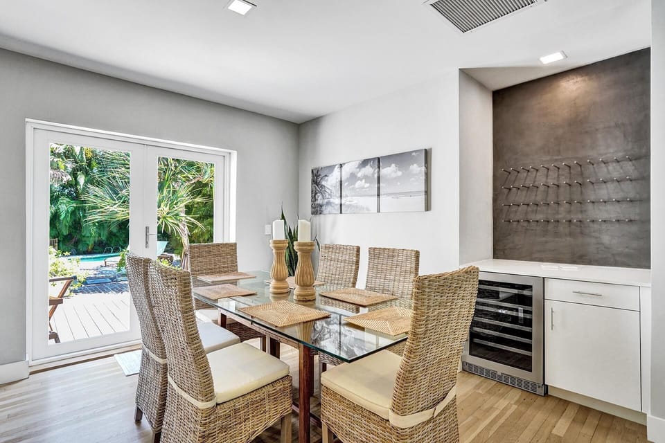 Indoor dining, wine rack and wine fridge...oh yeah, nice view of the backyard.