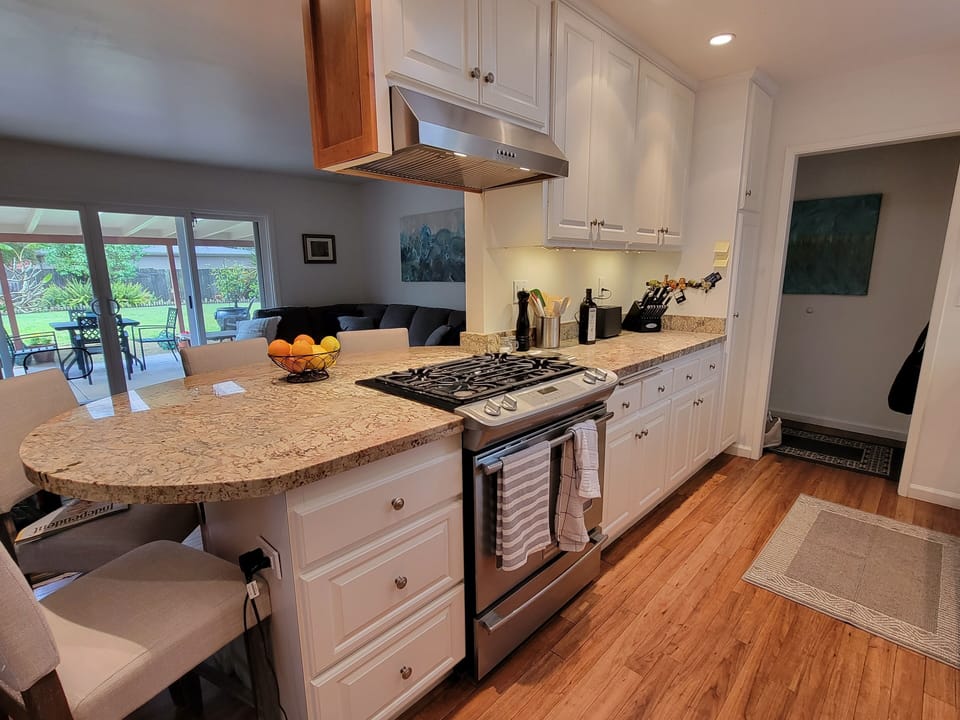 A very well stocked kitchen with gas range and newer appliances. 