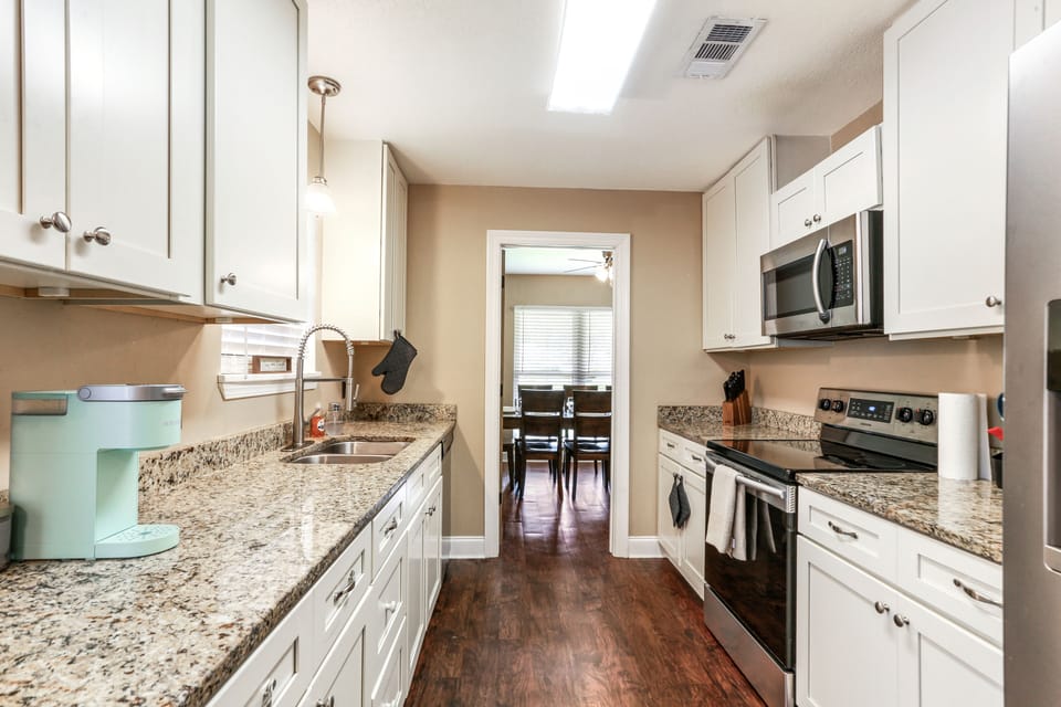 Full Kitchen with many amenities including 8 cup coffee maker AND Keurig 