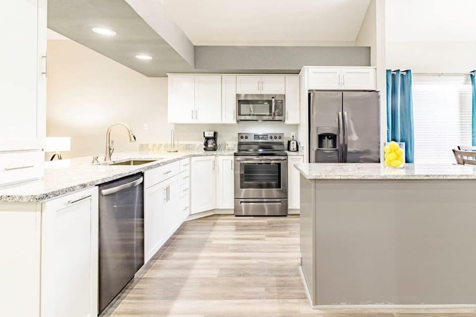 Kitchen overlooks Dining and Living Rooms.
