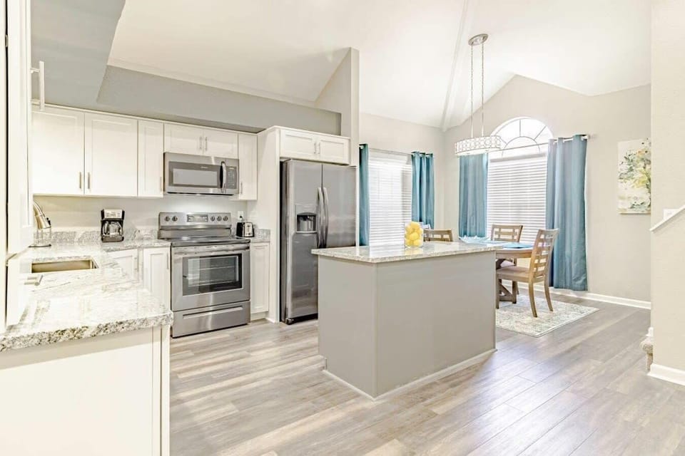 Kitchen includes an island for additional space.
