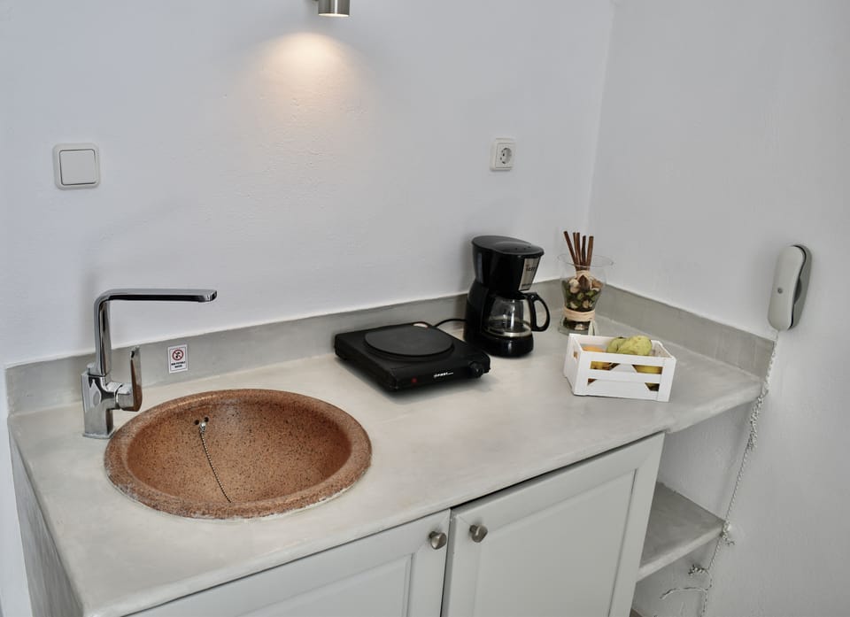 Junior Suite, Jetted Tub, Sea View (Meltemi) | Private kitchenette | Fridge, coffee/tea maker, electric kettle, cookware/dishes/utensils