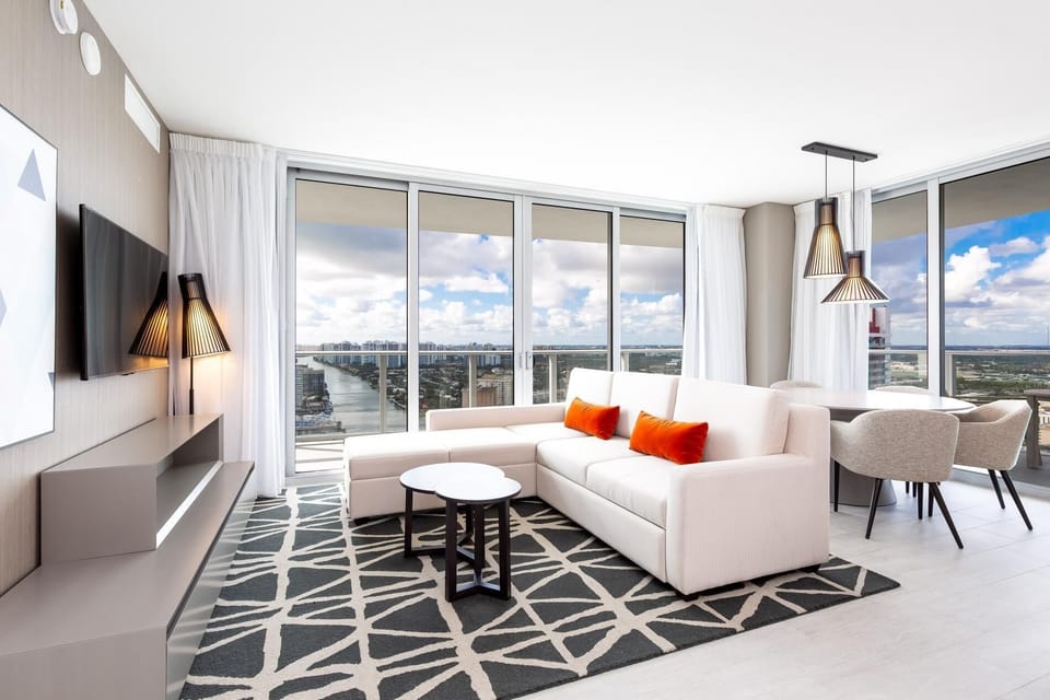 Soak in sunlit bliss and vibrant city views from your stylish haven.

