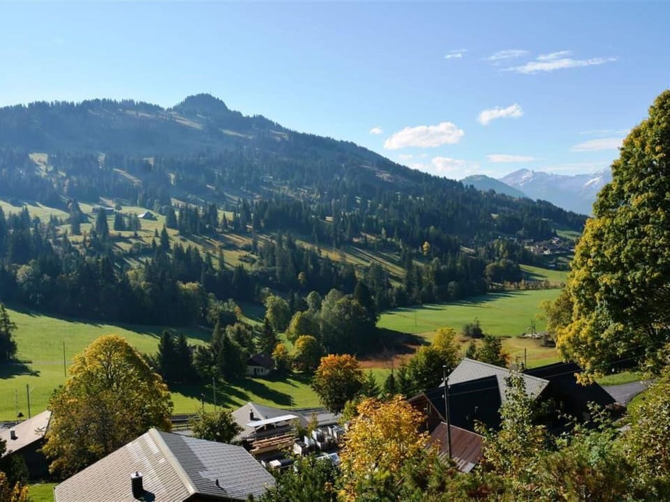 Sky, Cloud, Mountain, Plant, Natural Landscape, Natural Environment, Tree, Highland, Building, Sunlight