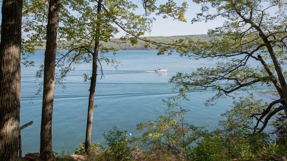 Fossil Beach offers 335 feet of private lake frontage and wooded seclusion.