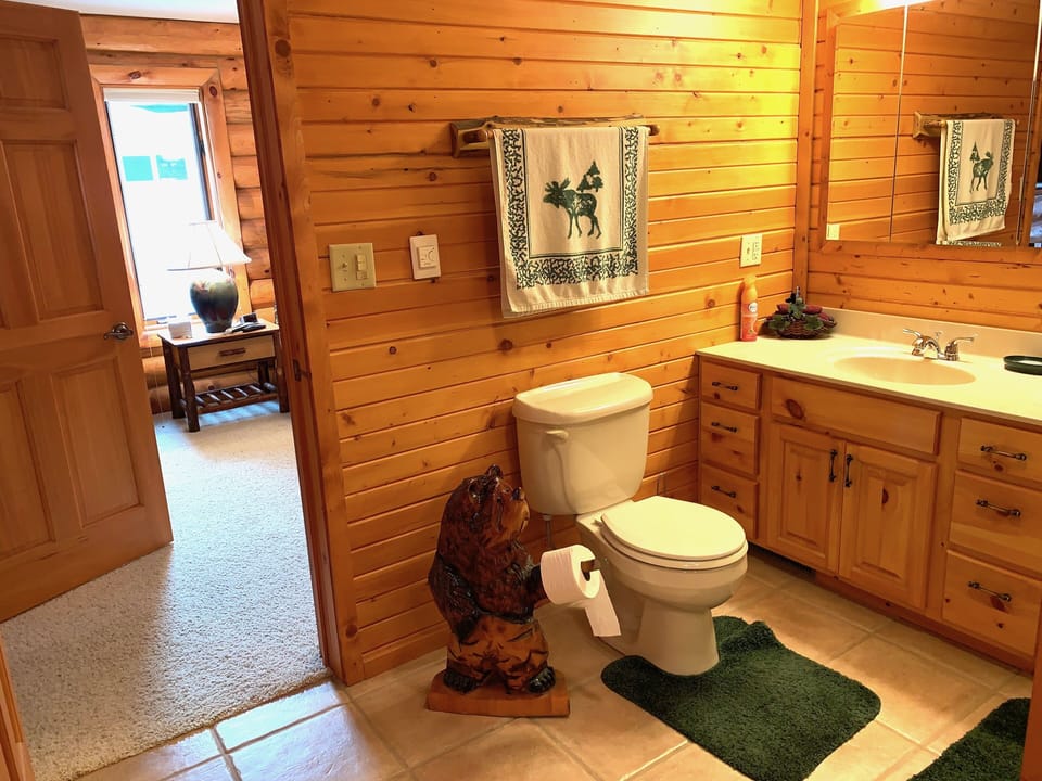 Main floor bathroom, includes tub and shower combo.