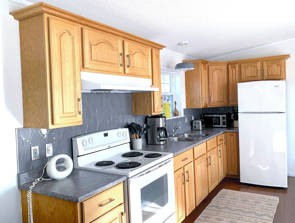 Enjoy our fully stocked, sunny kitchen.