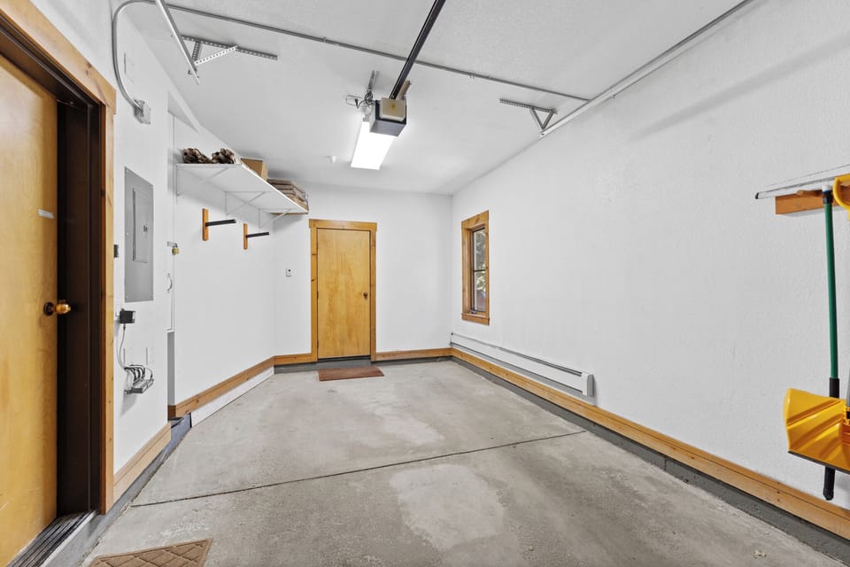 Spacious garage with organized storage shelving and convenient electrical outlets for your gear and vehicles.