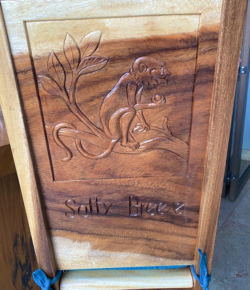 All chairs hand carved by local artisans.