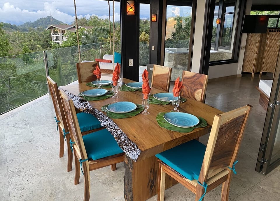 Hardwood Table made from river salvaged logs, hand carved chairs.