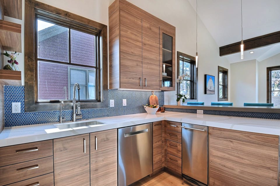Plenty of cabinetry and storage in the kitchen. Bosch stainless refrigerator.