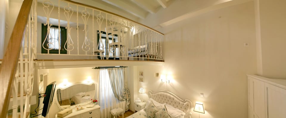 Superior Double Room | Living area | 28-cm flat-screen TV with digital channels, TV, DVD player