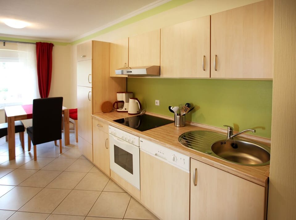 Apartment, Ground Floor | Private kitchen | Full-size fridge, oven, stovetop, coffee/tea maker