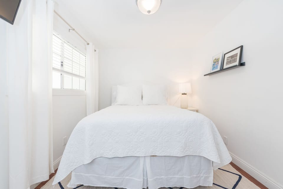 The primary bedroom includes a queen bed as well as cable/streaming TV. For extra sleeping accommodations, two trifold twin floor mats are provided. Guests can rent rollaway twin beds in lieu of the floor mats if desired.
                
