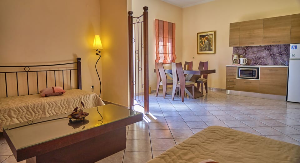 Chrismos Luxury Suites 4A Apraos Corfu - living room - sofa beds and dining area