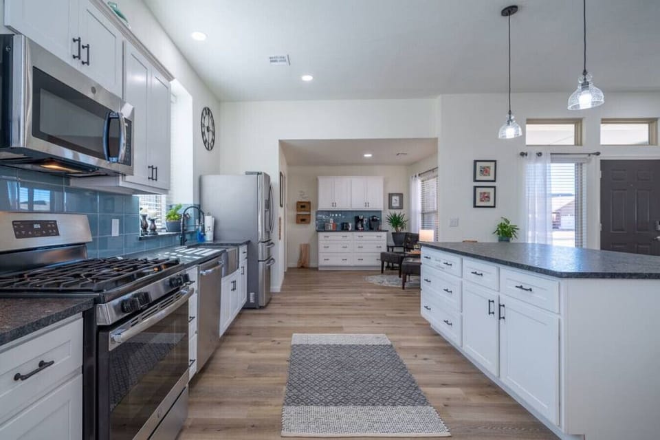 Fully equipped kitchen with modern appliances and ample counter space.