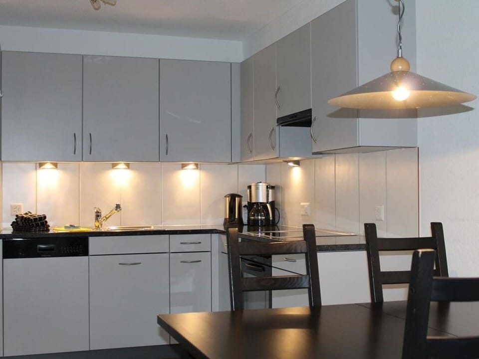 Cabinetry, Countertop, Property, Table, Light, Kitchen, Wood, Lighting, Interior Design, Chair