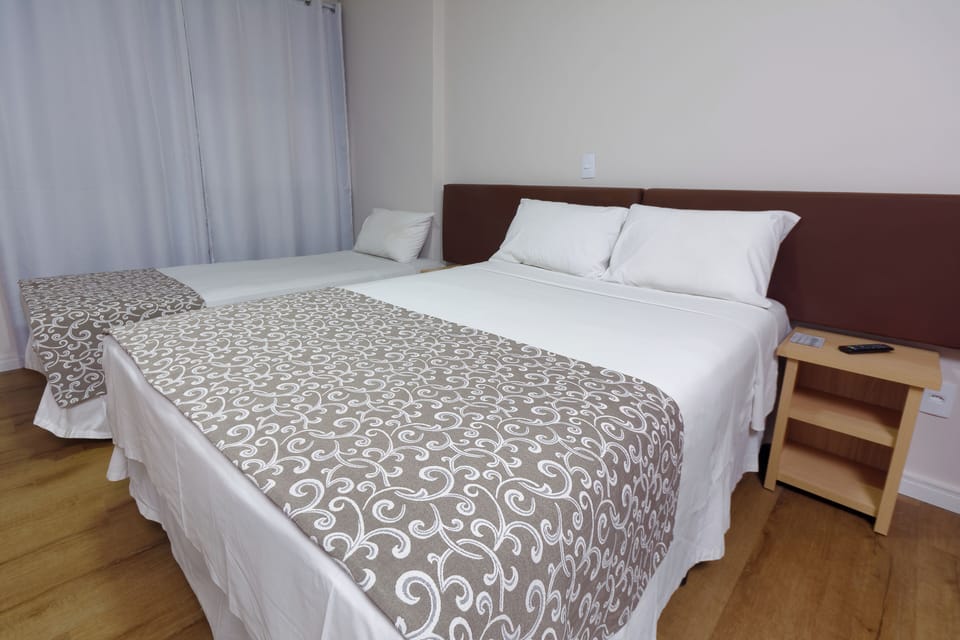Junior Triple Room | Minibar, desk, free WiFi, bed sheets